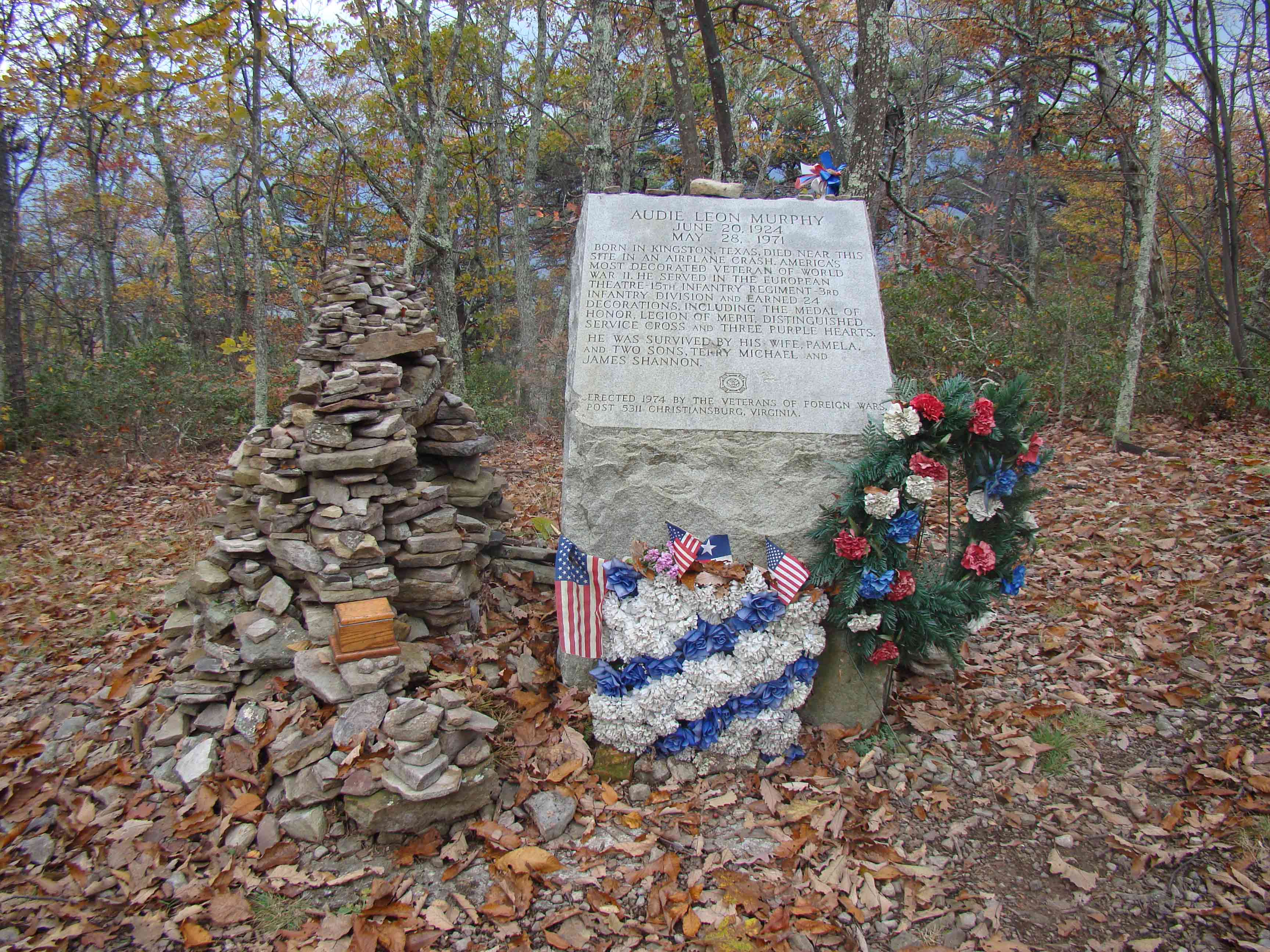 mm 11.7  Audie Murphy Monument, reached by a short blue-blazed
trail from the AT.  Murphy was a highly decorated World War II veteran and
later movie actor who was killed in a plane crash near here.  Hikers have
crated an unofficial monument of rocks next to the official one.   Courtesy
ideanna656@aol.com