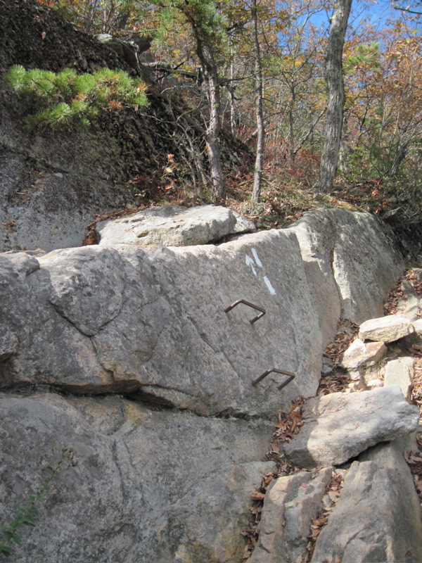 Part of the rock scramble trail north from Dragons Tooth. Note
the rebar imbedded in the rock. There are two places where this occurs.
One does not really need it at the other place. Here it is very helpful in
negotiating this section. Taken at approx. mm 2.4  Courtesy
dlcul@conncoll.edu