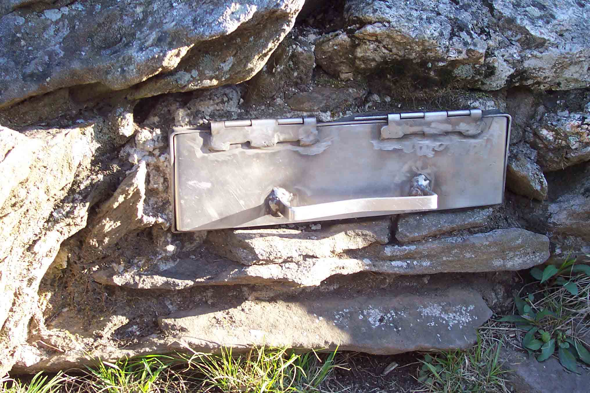 mm 8.6 This is a slot built into the rock commemorating the southern end of the AT. The trail log is kept inside.  Courtesy wbmcp@hotmail.com