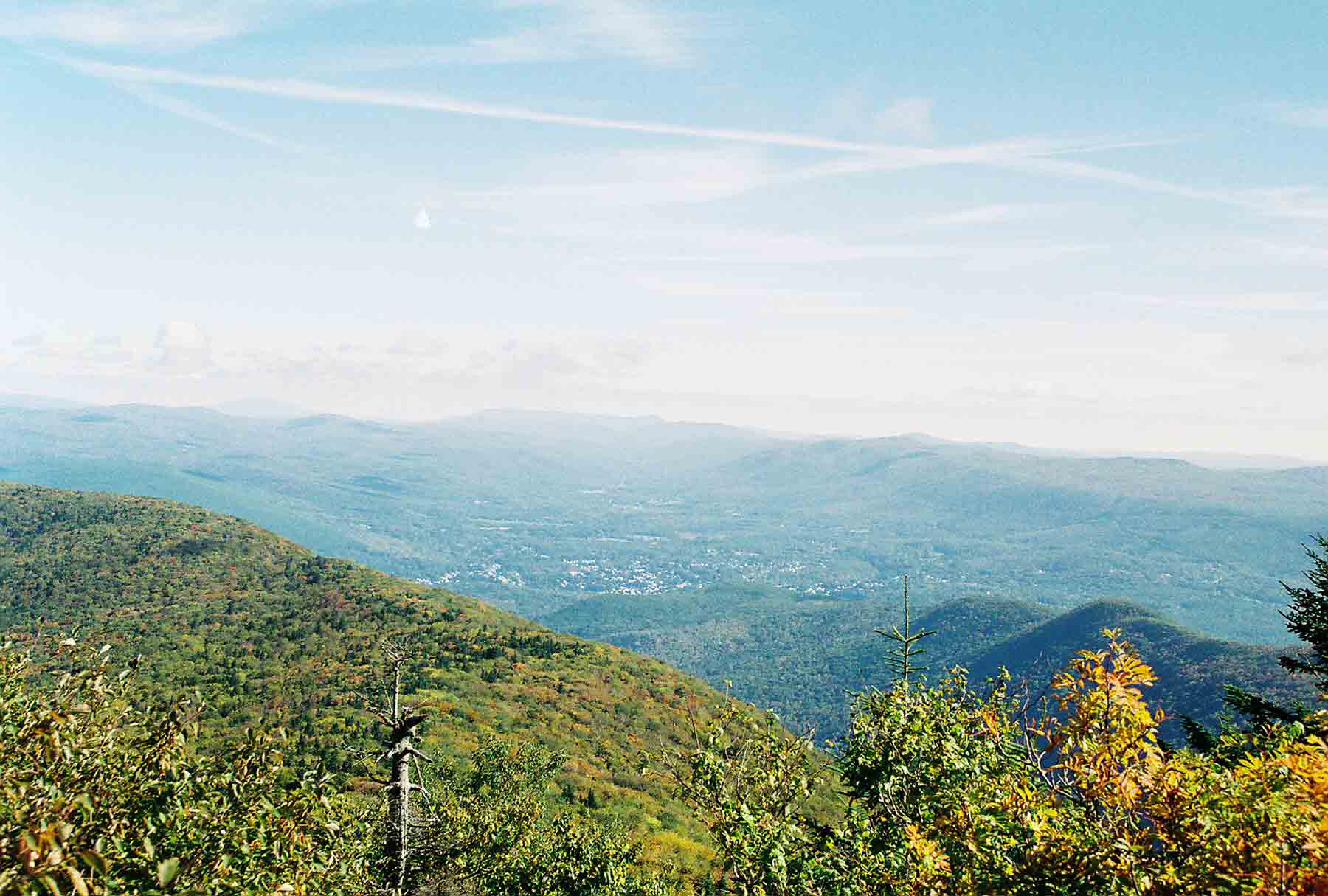 mm 6.3 - View to the north from the summit of Mt. Greylock. The built up area visible is North Adams/Williamstown. Glastenbury Mountain can be seen in the distance in the center of the picture. Stratton Mountain is also visible (barely) to the left of center. The AT crosses both of these peaks.  Courtesy dlcul@conncoll.edu