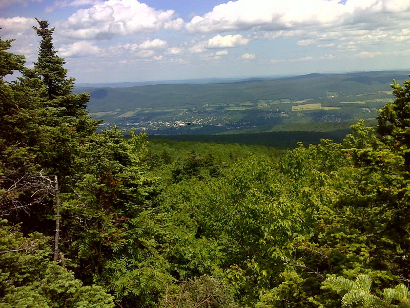 View of Adams, MA from a limited viewpoint south of Jones Nose.   GPS N42.6124 W73.1911  Courtesy pjwetzel@gmail.com