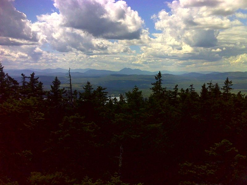 mm 29.7 View to the southwest from summit of Pleasant Pond Mountain. The Bigelow Range is prominent in the center of the picture. GPS N45.2721 W69.9242  Courtesy pjwetzel@gmail.com