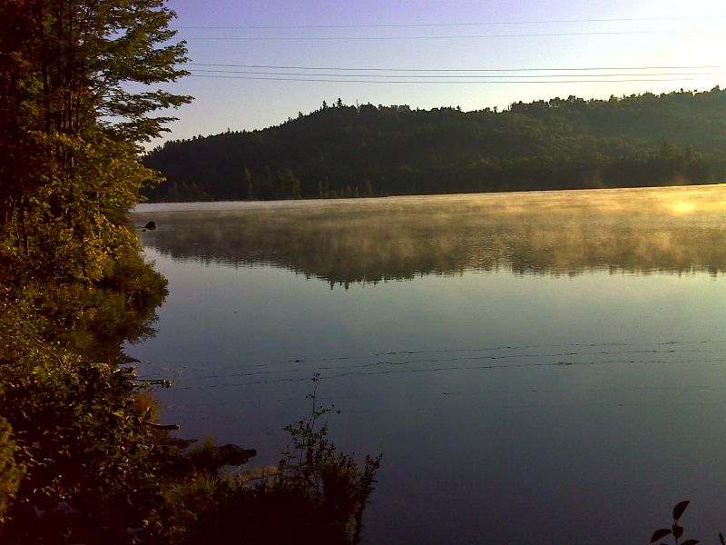 Morning mist on Joes Hole which is part of Moxie Pond.  GPS N45.2510 W69.8306.  Courtesy pjwetzel@gmail.com