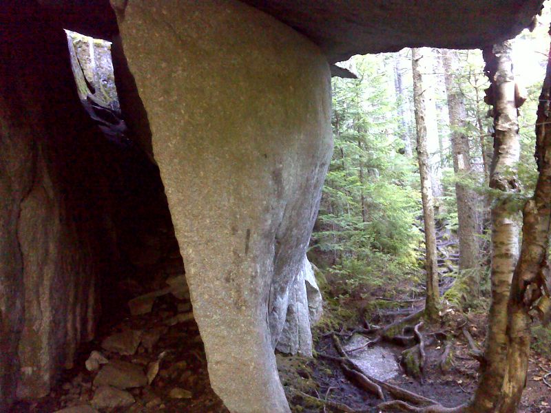 Rock formation which I call the Lobster Claw.  A huge rock juts out over the trail.  There is a tunnel on the left.  The official AT is on the right. GPS  N45.2634 W69.7764  Courtesy pjwetzel@gmail.com
