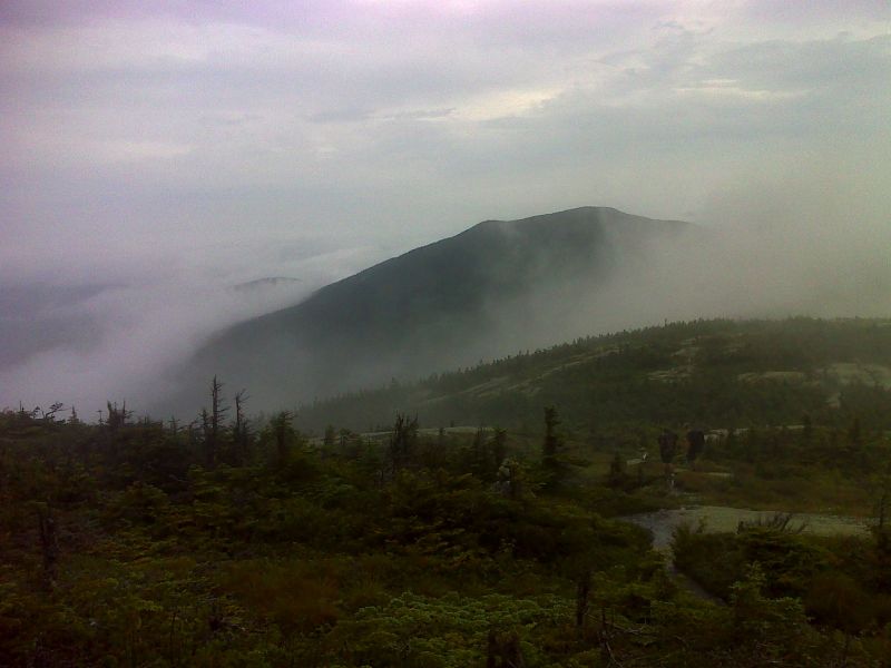 View from north slopes of Saddleback Mt. as the fog starts to lift.    GPS N44.9418 W70.4992  Courtesy pjwetzel@gmail.com