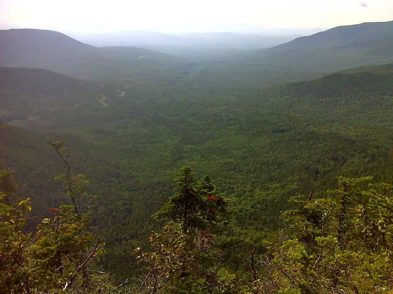 A hazy view to the south from ridge trail south of Sugarloaf.  GPS N45.0244 W70.3208  Courtesy pjwetzel@gmail.com
