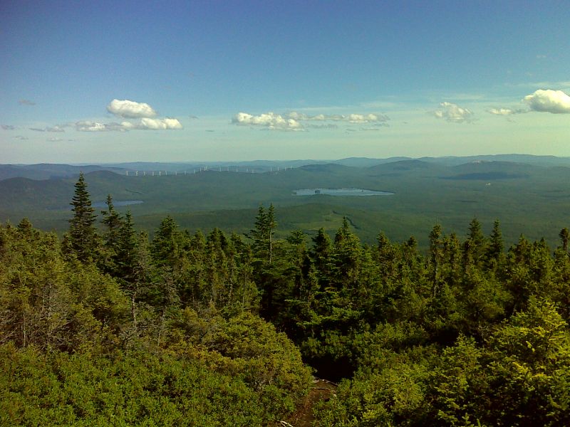 mm 10.5 View of Little Ellis and Ellis Ponds as well as wind turbines from the summit of Old Blue Mt.  GPS N44.7462 W70.7658  Courtesy pjwetzel@gmail.com