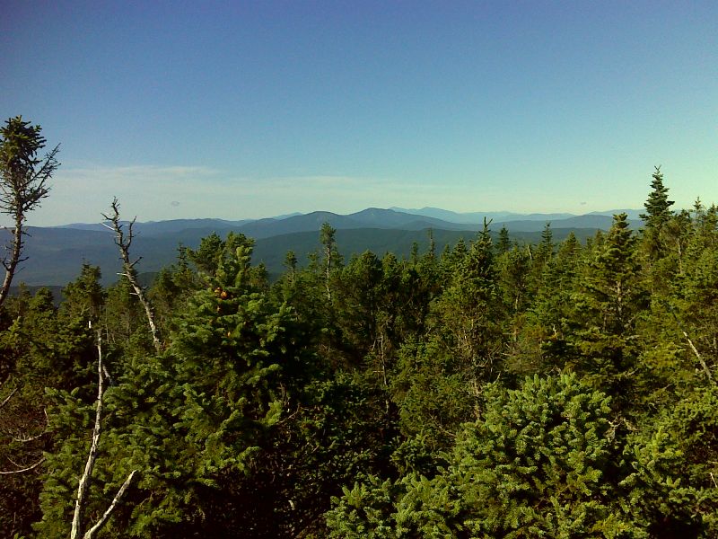 mm 10.5 View of Baldpate Mt., Old Speck Mt. and the Presidential Range from the summit of Old Blue Mt.  GPS N44.7461 W70.7658  Courtesy pjwetzel@gmail.com