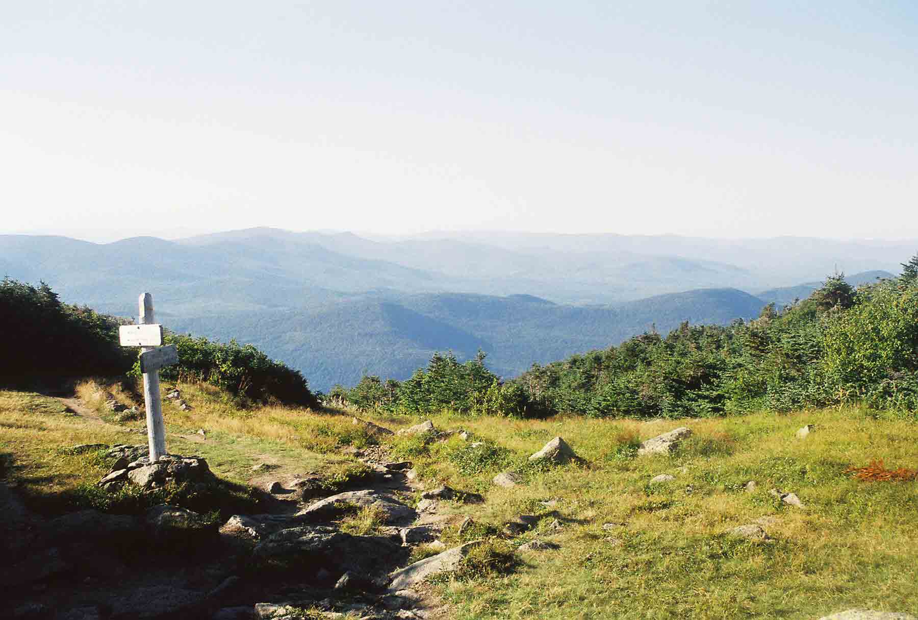 Looking north from the vicinity of the hut. The trail sign marks the junction of the Gulfside Trail (AT) and the Valley Way. The former heads west and south to traverse the Presidential Range. The latter descends north to US 2. Courtesy dlcul@conncoll.edu