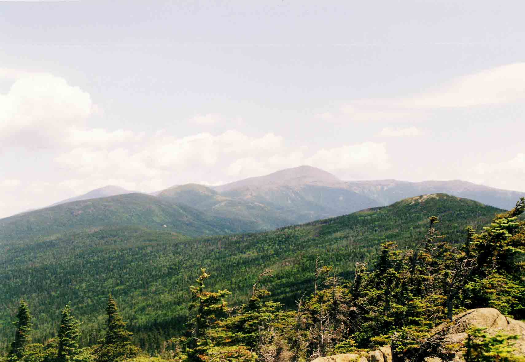 mm 22.7 - Looking north from the summit of Mt. Webster along the Presidental Range to Mt. Washington. The peak on the left in the far distance is Mt. Jefferson. Courtesy dlcul@conncoll.edu