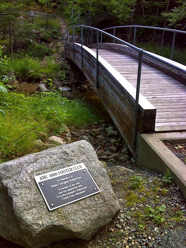 mm 25.9 Dedication plaque and footbridge across the Saco River.  GPS 44.1713 N71.3858  Courtesy pjwetzel@gmail.com