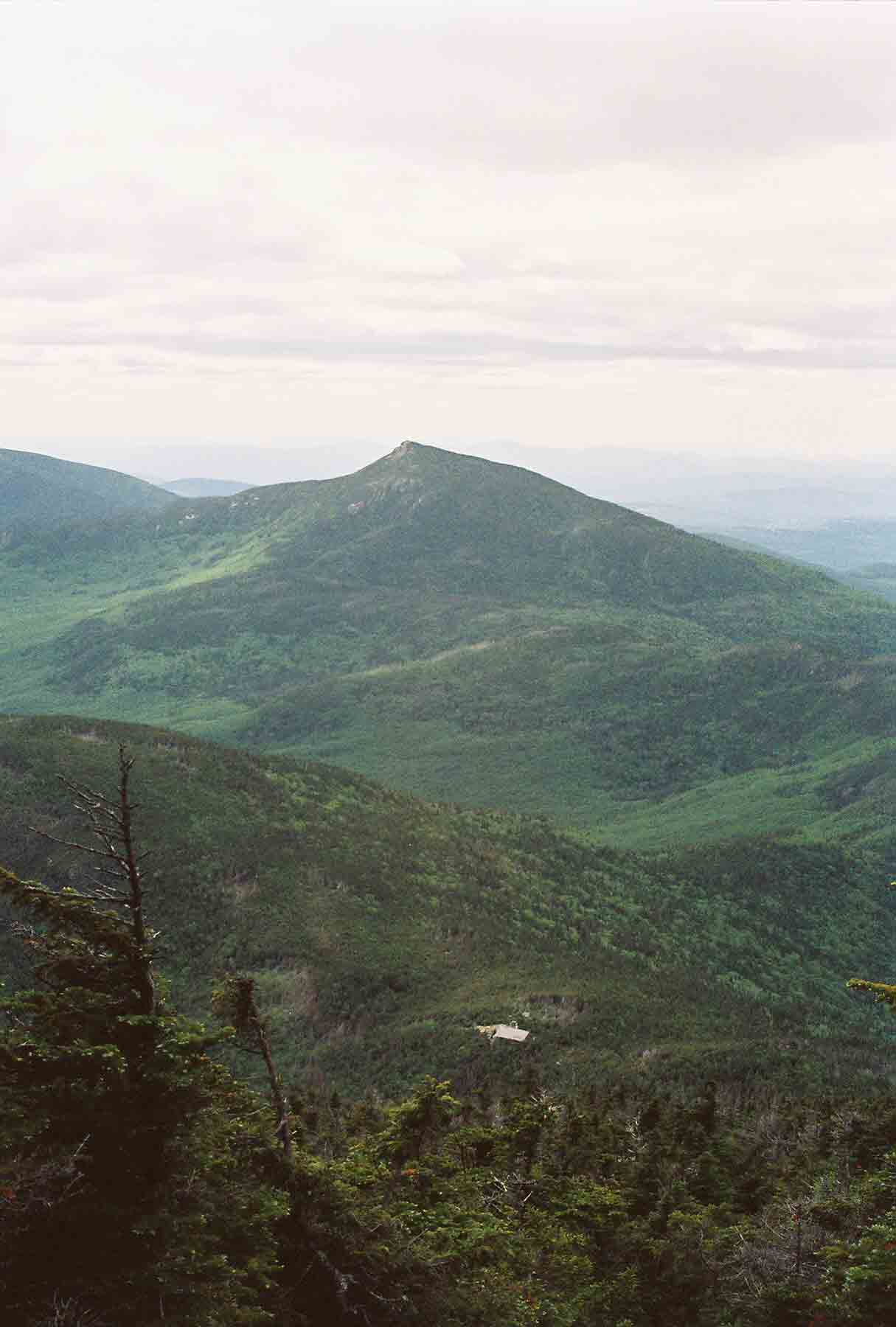 mm 13.9 - View along Garfield Ridge from South Twin. Galehead Hut, one trail mile and a 1100 foot descent away, is visible.  Courtesy dlcul@conncoll.edu