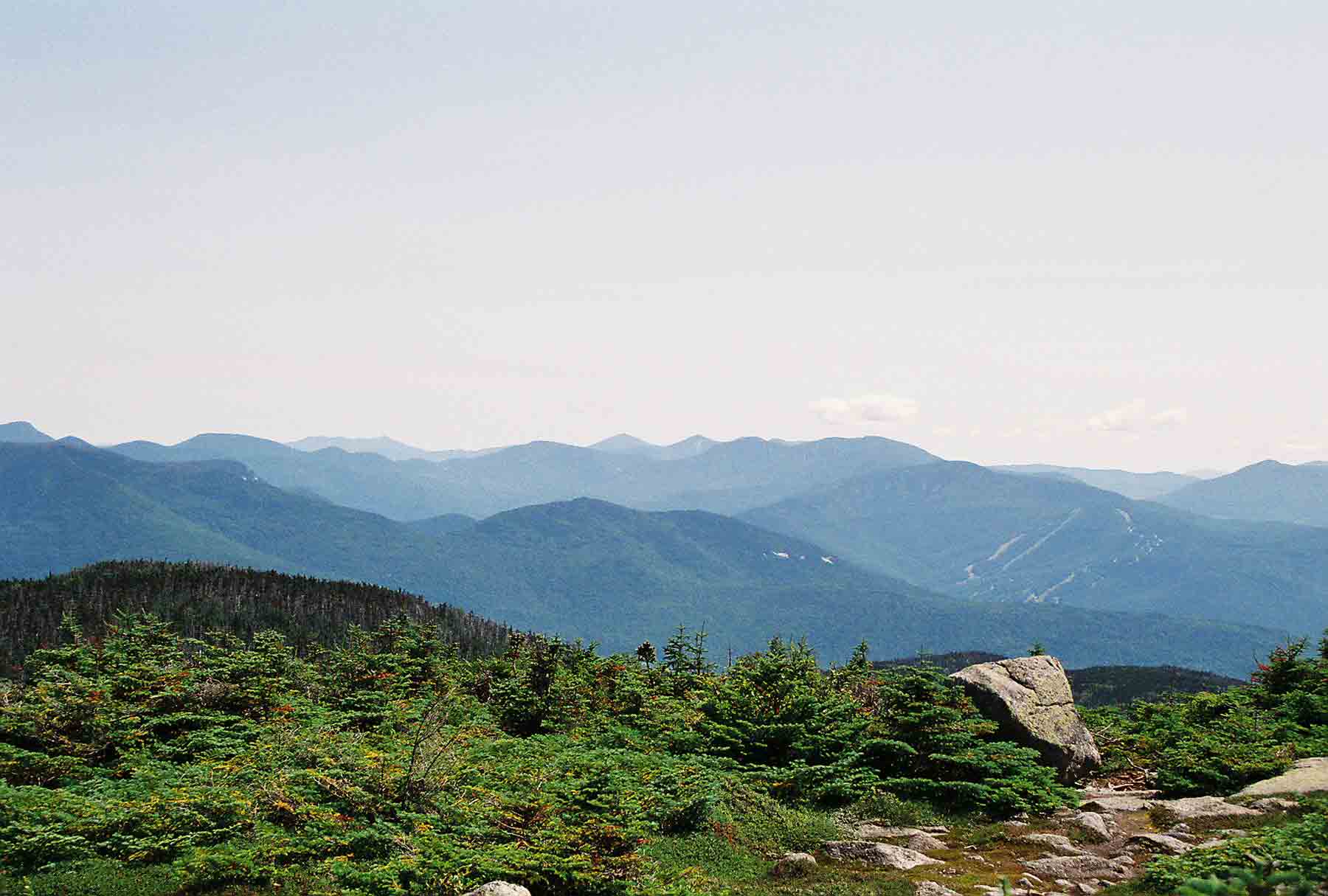 View to the southeast from the summit of South Kinsman. The Loon Mt. Ski Area near Lincoln can be seen on the right.  Courtesy dlcul@conncoll.edu