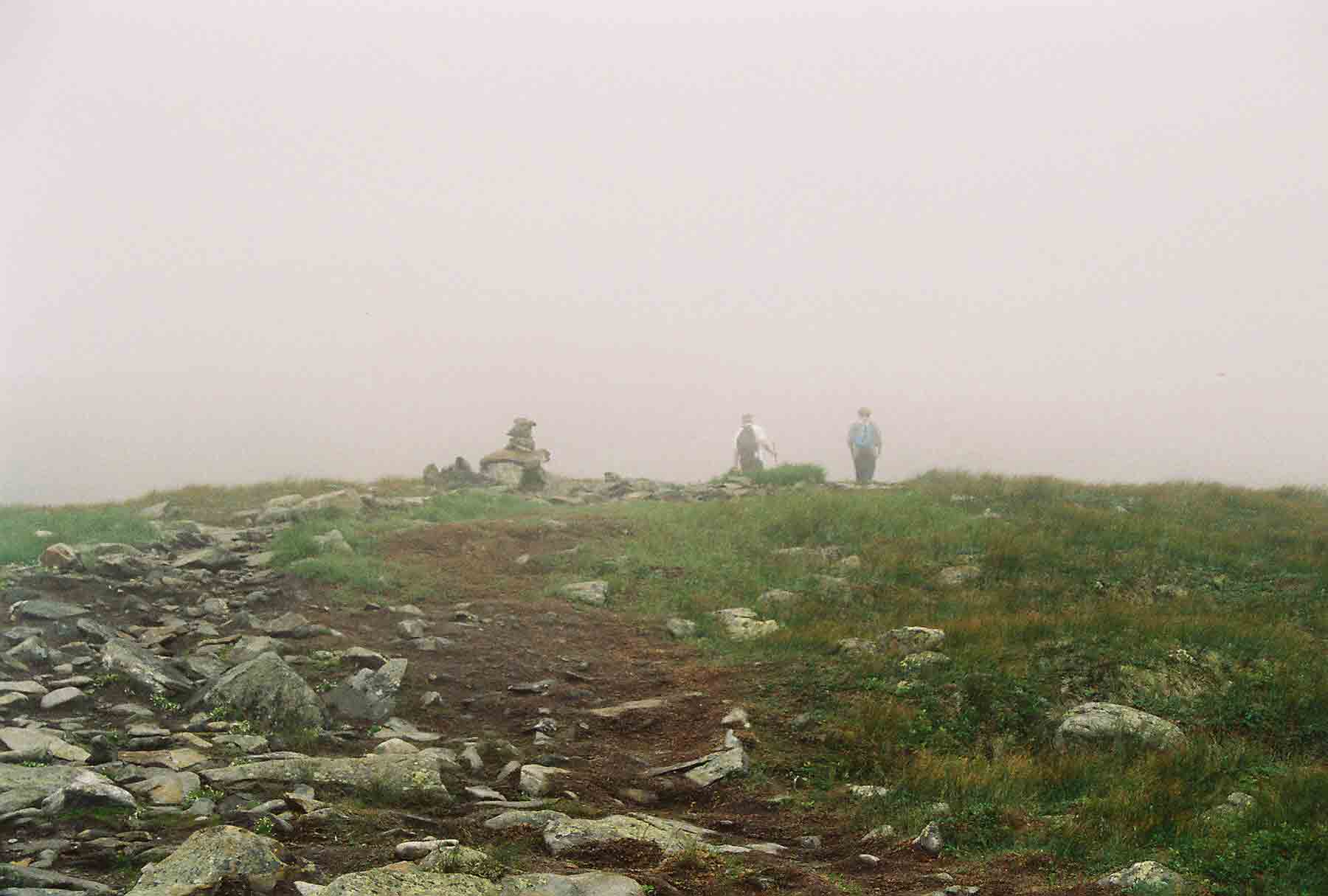 mm 3.8 - Approaching the summit of Mt. Moosilauke.  Northbound on the AT this is the first time the trail goes above tree line.  On this day the summit was totally in the clouds.  It started to clear as we left and by the time we got to the base of the mountain, it was a clear day.    Courtesy dlcul@conncoll.edu
