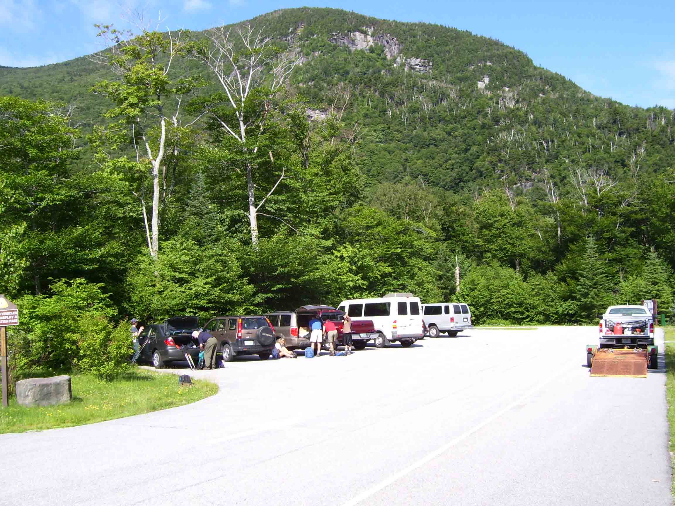 mm 0.0 - USFS parking area in Kinsman Notch (NH 112). There is more parking on the other side of the line of trees on the left.  Courtesy dlcul@conncoll.edu