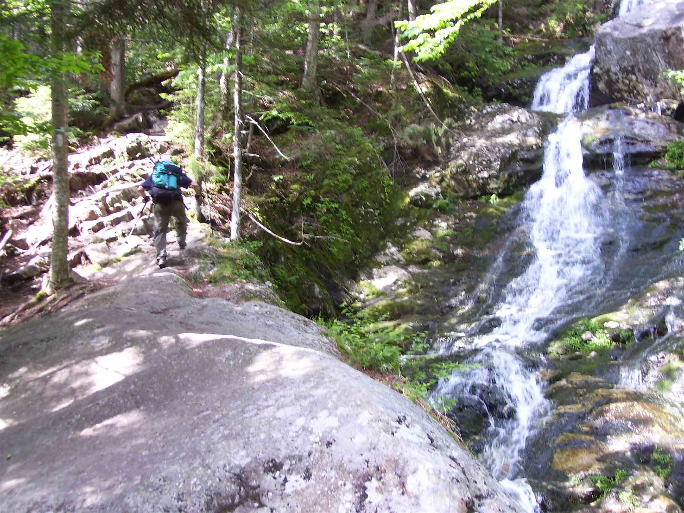Climbing on the Beaverbrook Trail. This extremely steep portion of trail climbs 2000 feet in 1.6 miles, most of it along a almost continuous series of falls and cascades of Beaver Brook. This is the lowest major cascade.  Courtesy dlcul@conncoll.edu
