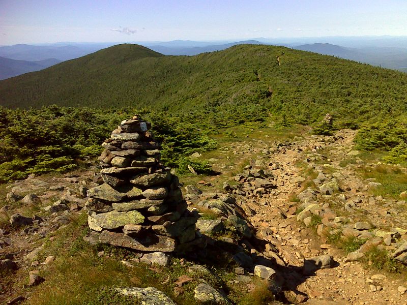 View of AT southbound from tree line on the south slope of Mt. Moosilauke.  GPS N44.0213  W71.8382  Courtesy pjwetzel@gmail.com