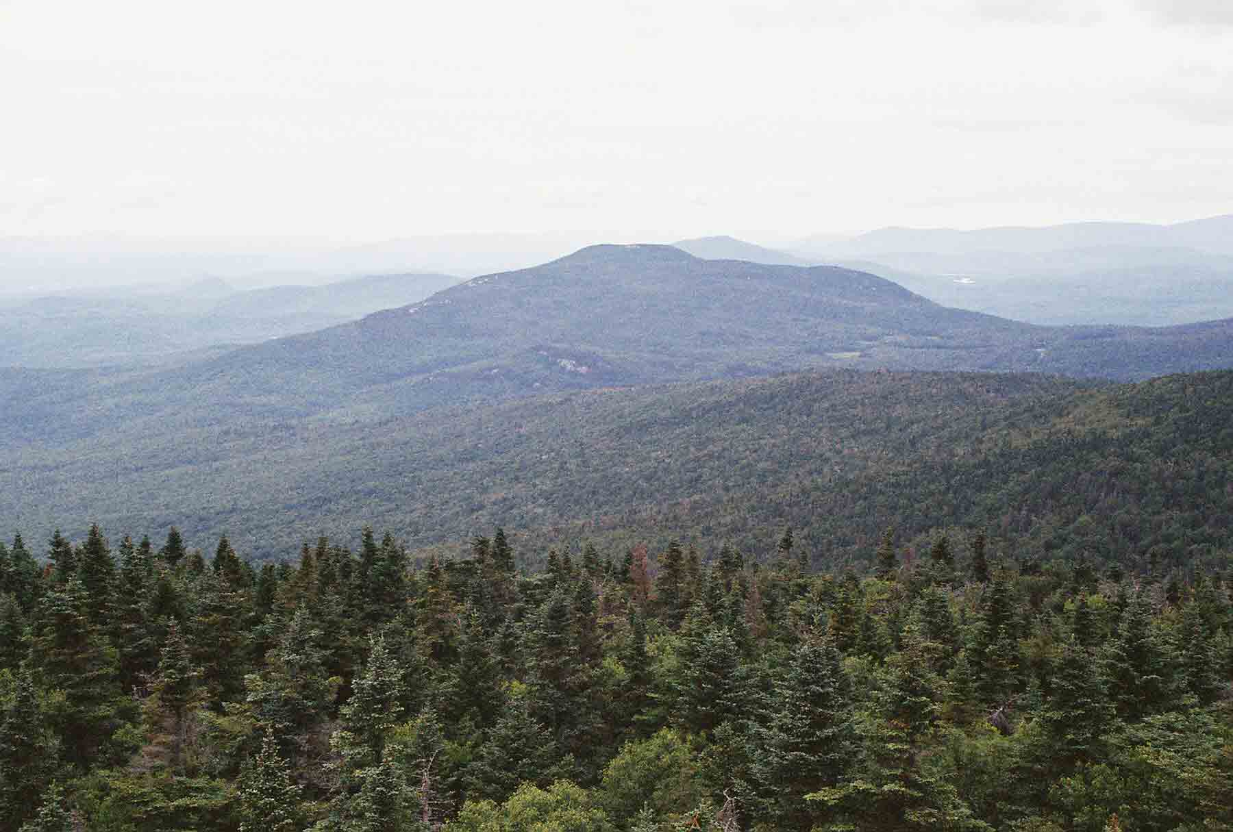 mm 10.2 View North from Smart's Mt. Firetower towards Mt. Cube. The northbound AT descends the ridge on the right to S. Jacobs Brook, then goes up and over Mt. Cube.  Courtesy dlcul@conncoll.edu