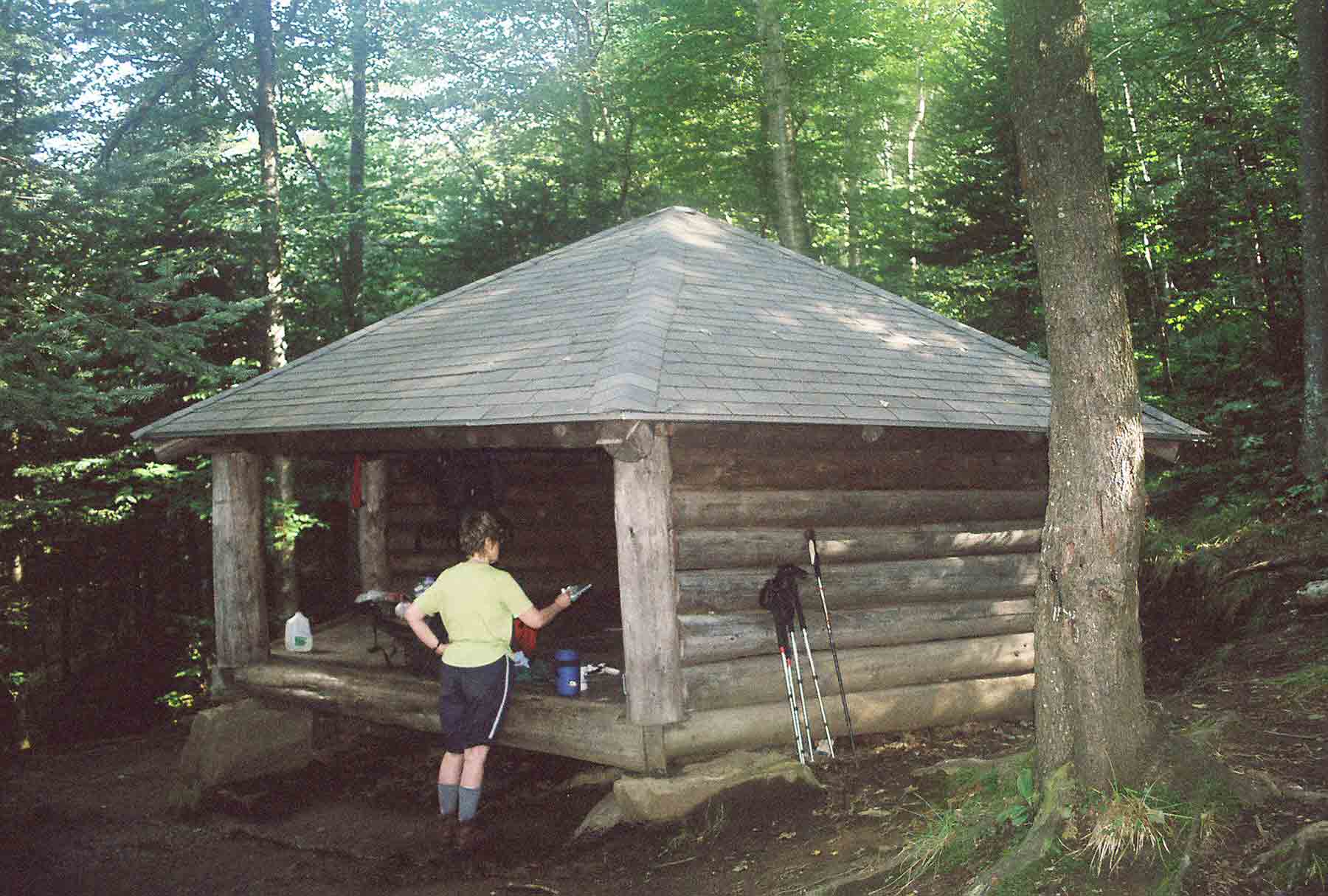 mm 4.9 - Hexacuba Shelter. Hexagonal shaped shelter on the south side of Mt. Cube. In keeping with the geometrical theme, the Dartmouth Outing Club which maintains this section, has built a five sided privy, hence the Penta Privy. Courtesy dlcul@conncoll.edu