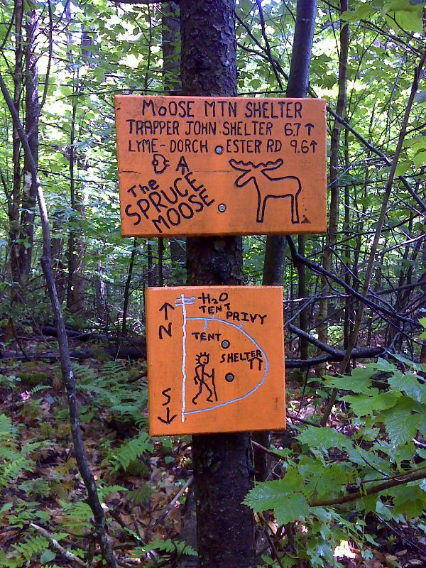 mm 6.6 Fun with Signs 2. Dartmouth Outing Club (DOC) signs at intersection with side trail to Moose Mountain Shelter.  GPS 43.7268  N72.1497  Courtesy pjwetzel@gmail.com