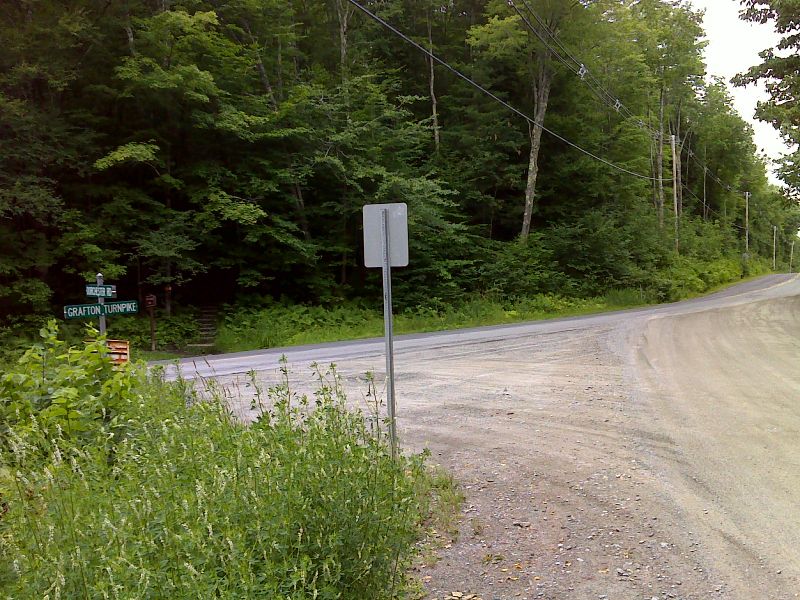 mm 0.0  Junction of Grafton Pond Road and Lyme-Dorchester Road near Dartmouth Skiway.  Parking is possible here. The southbound trail can be seen going int the woods across the road.   N43.7925 W72.1026  Courtesy pjwetzel@gmail.com