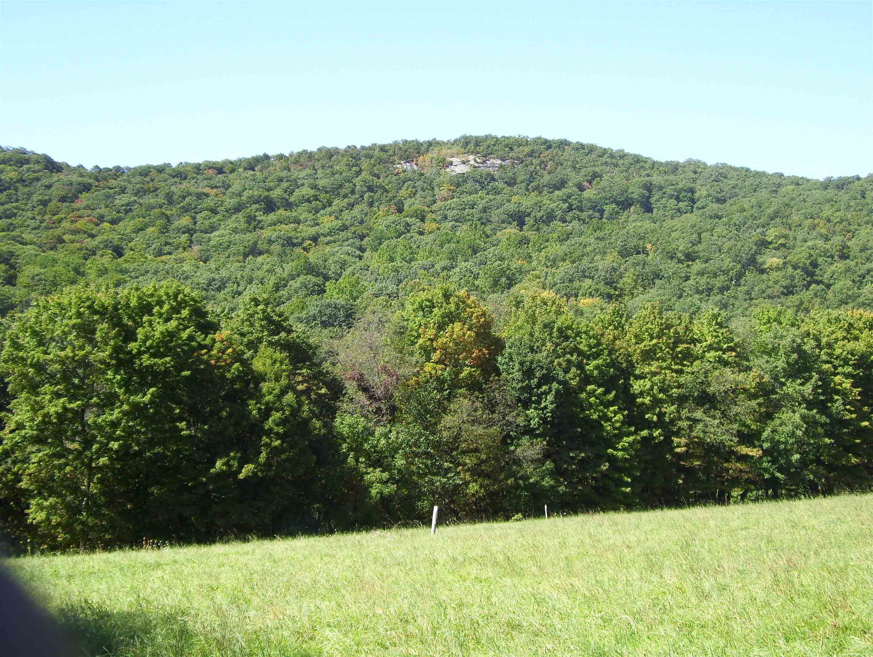 View to west as southbound trail approaches County Road 20 and Dover Oak.  Note the rock cliffs near the top of the mountain (West Mt.).  The trail goes by the top of these then completes the ascent of the mountain.  Taken at approx. mm 2.3.  Courtesy dlcul@conncoll.edu