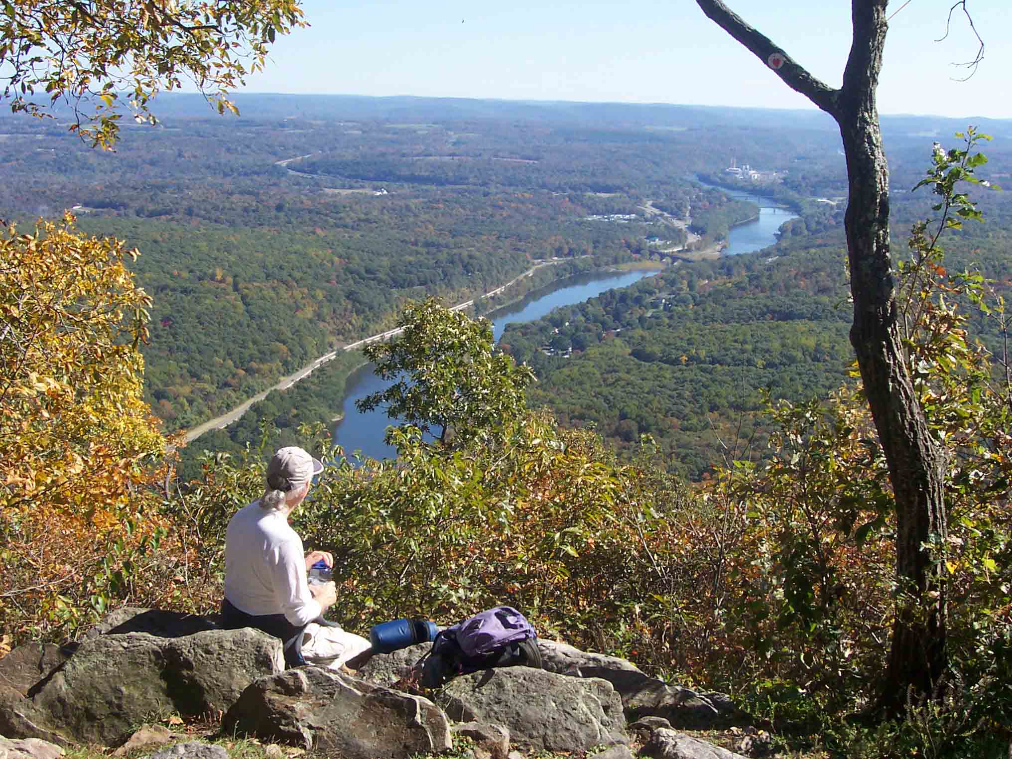 mm 2.8 - Barry admires view of Delaware River from viewpoint about 0.1 miles south of Mt. Minsi summit.  New Jersey is on the left side, Pennsylvania on the right.  Courtesy dlcul@conncoll.edu