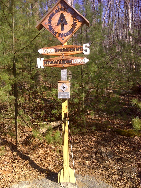 The new halfway marker sign.  In April 2012 this was just north of Toms Run Shelters, the correct position for the 2011 trail.  The 2012 halfway point is just south of the shelters.  GPS N40.0325 W77.3122  Courtesy pjwetzel@gmail.com