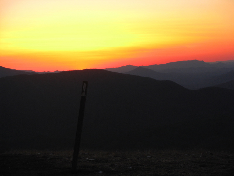 mm 19.8 Sunset from the summit of Max Patch.  The navigation tower on Snowbird Mountain can be seen just to the right of the setting sun.    Courtesy pjwetzel@gmail.com