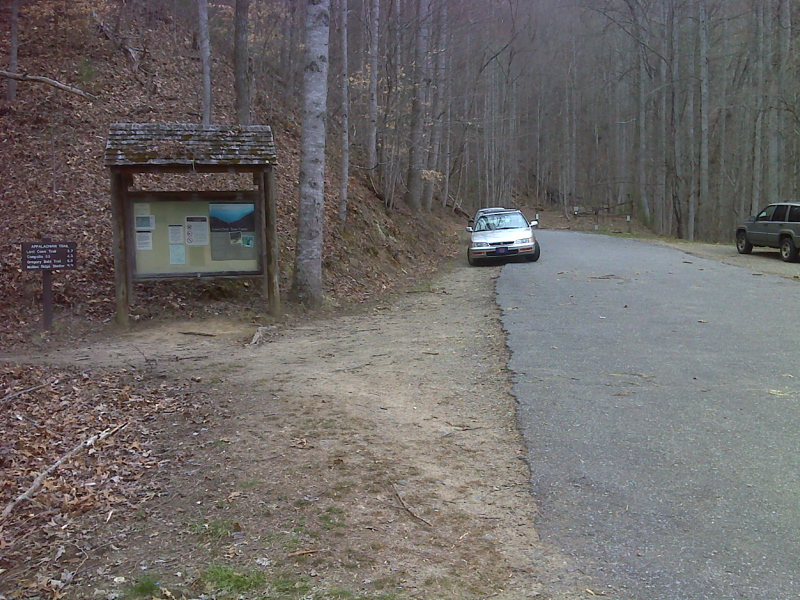 mm 39.7 Parking area and end of 1.5 mile roadwalk for northbound AT, Fontana lake. From here it is 32 miles before the northbound AT even comes close to a road.  The next road crossing is in Newfound Gap 40 miles away.  Southbound the trail follows the road  towards Fontana Dam. GPS N35.4605 W83.8111  Courtesy pjwetzel@gmail.com