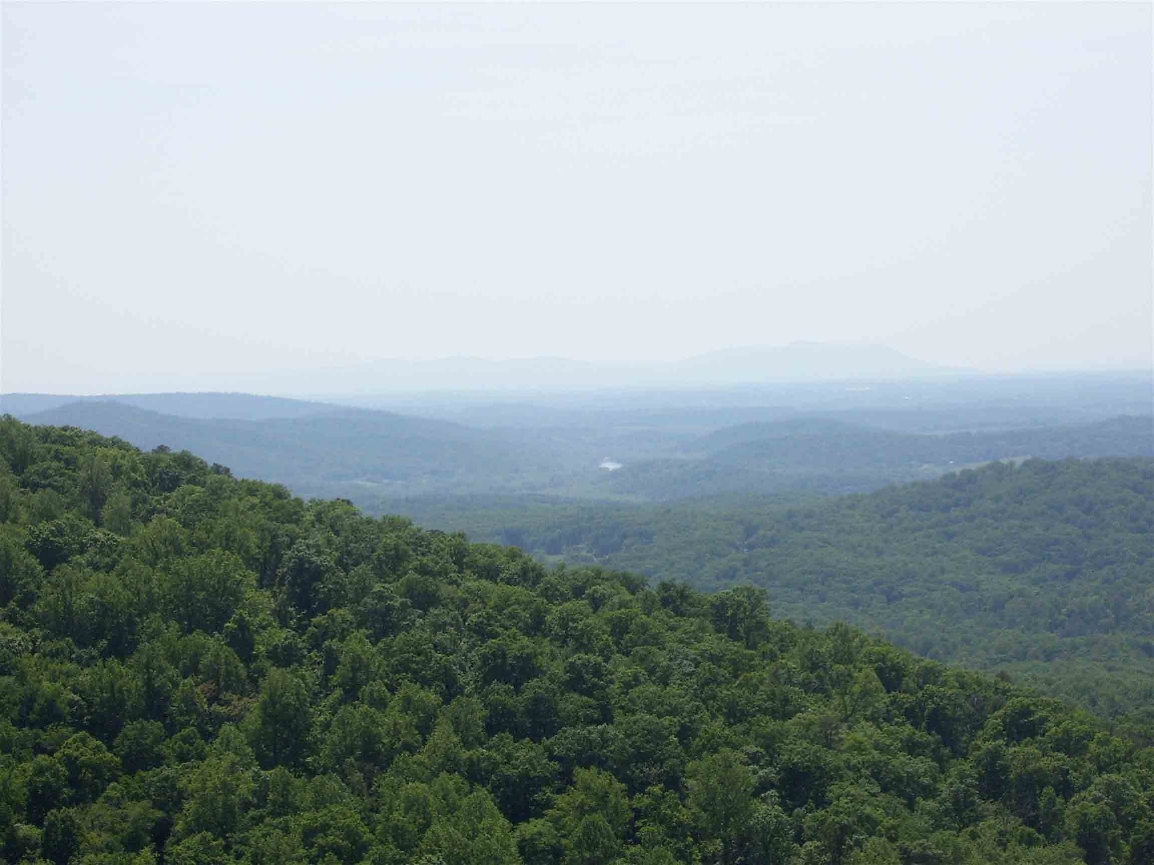 View to the southwest from Crescent Rock (Mile 10.9). The Shenandoah River can be seen. In the hazy far distancce is Massanutten Mountain.  Courtesy dlcul@conncoll.edu