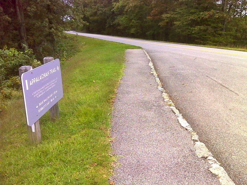 mm 2.5 Sign and crossing of Blue Ridge Parkway at Sharp Top  Overlook.  GPS N37.4745 W79.6919  Courtesy pjwetzel@gmail.com