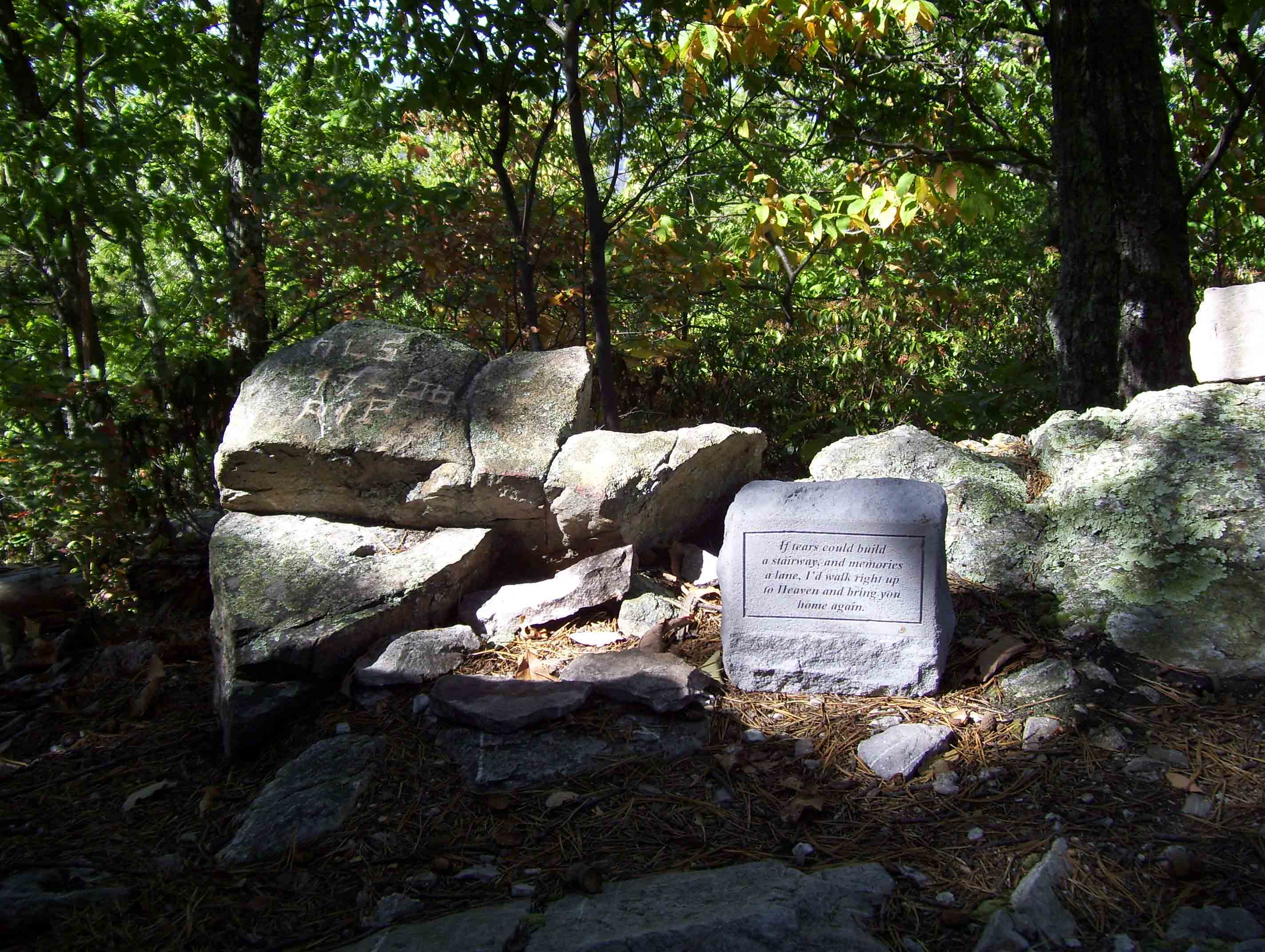 mm 1.1 - Someone has placed a memorial on top of Shirley's knob with this small stone. Note the carving on the rock to the left.  Courtesy dlcul@conncoll.edu