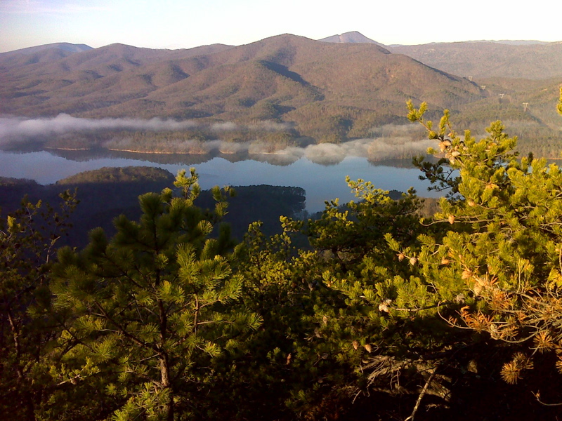 mm 2.7 Carvin Cove Reservoir (Roanoke water supply) from the
Appalachian Trail. McAfee Knob is the prominent peak right of center.
GPS:  N37.3857 W79.9349  Courtesy pjwetzel@gmail.com