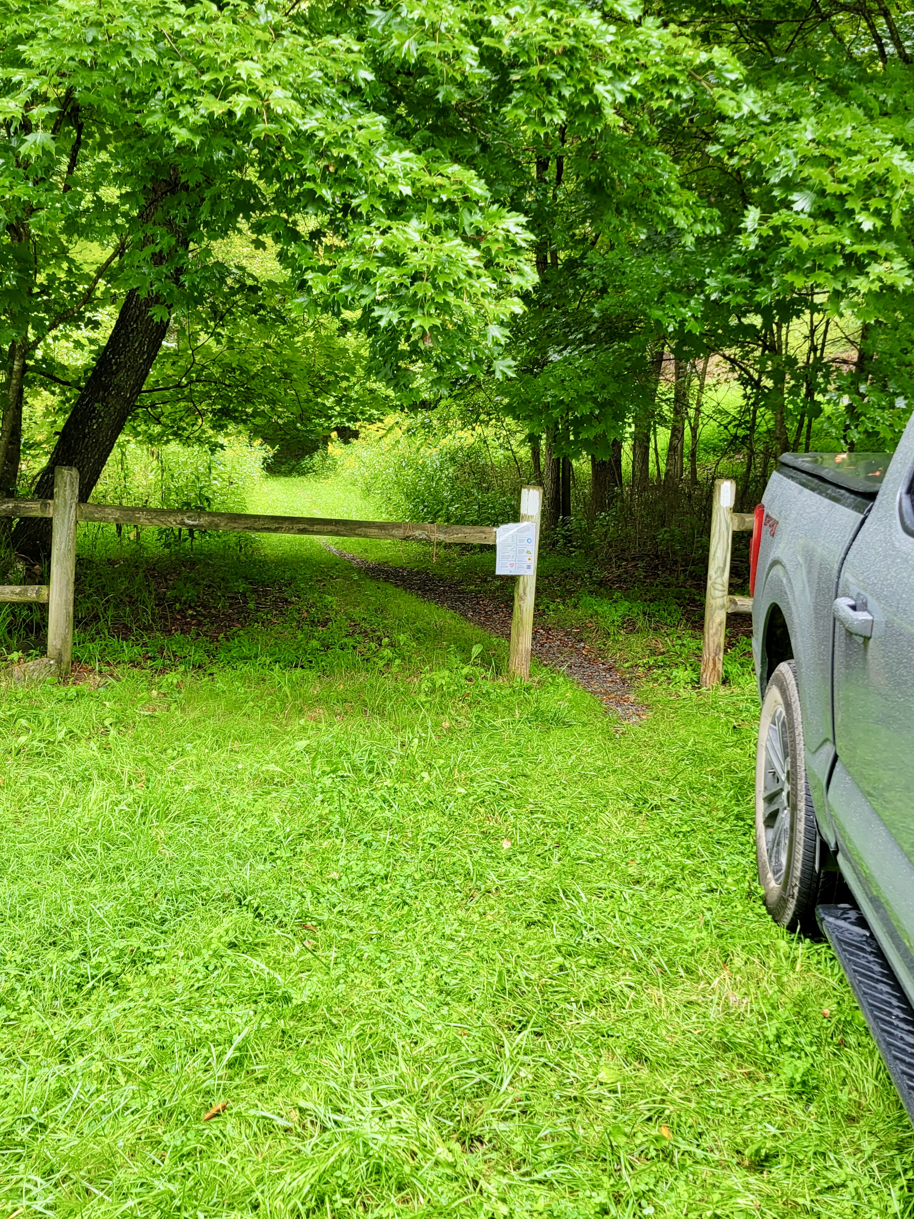 mm 10.4 The northbound trail goes through this opening in the fence as it leaves the parking area on VA 630.   Courtesy cabincellars@yahoo.com