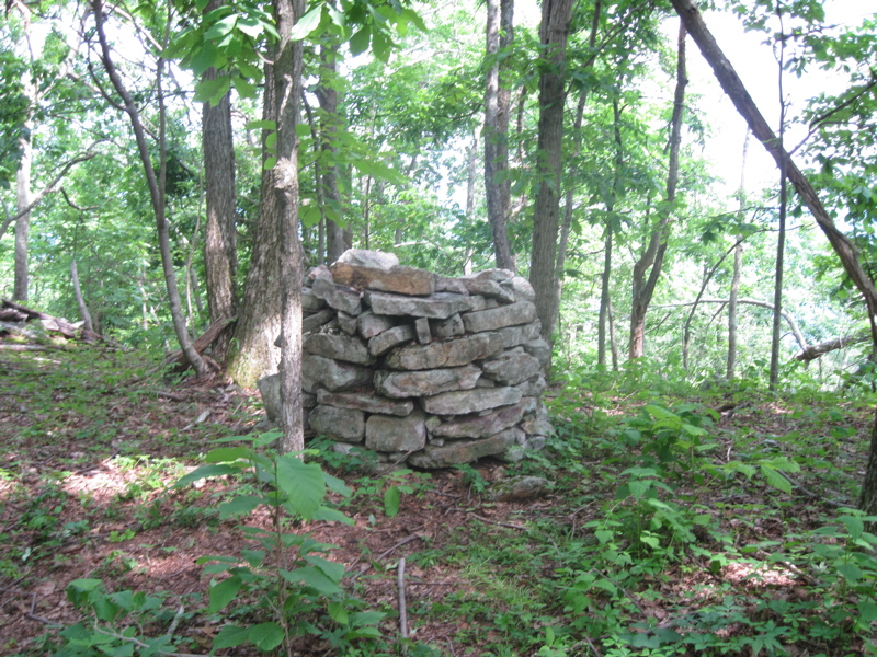 The AT passes through an area with dozens of piles of rocks on the ridge crest. Thee were probably put there by farmers who dug them up while trying to till the land. Most are just haphazard piles but a few like this one are stacked neatly. Taken at approx. mm 7.6 Courtesy dlcul@conncoll.edu