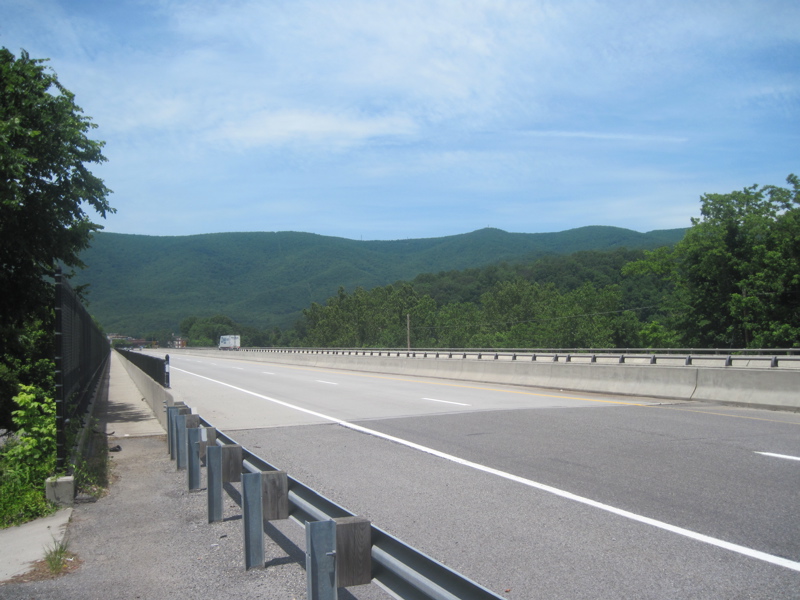 mm 19.1  Looking northboound at the east end of the Shumate Bridge across the New River near Pearisburg. The AT follows the pedestrian walkway across the bridge. Peters Mountain is in the background.  
       Courtesy dlcul@conncoll.edu