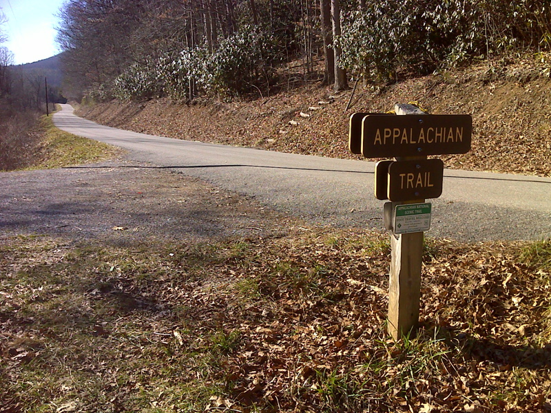 mm 7.9. View of the Trail crossing and parking area on Va 670 (Teas Road).  The northbound trail goes up the log steps on the right side of the road. Courtesy pjwetzel@gmail.com