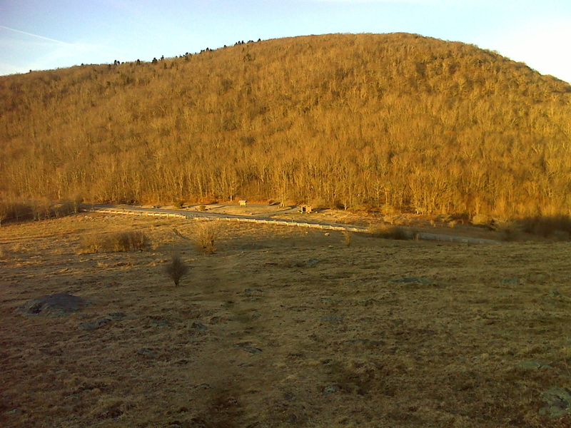 View as the southbound trail descends through pastures to Elk Garden.  The AT parking lot on VA 600 can be seen.  Taken at approx. mm 16.7  Courtesy pjwetzel@gmail.com