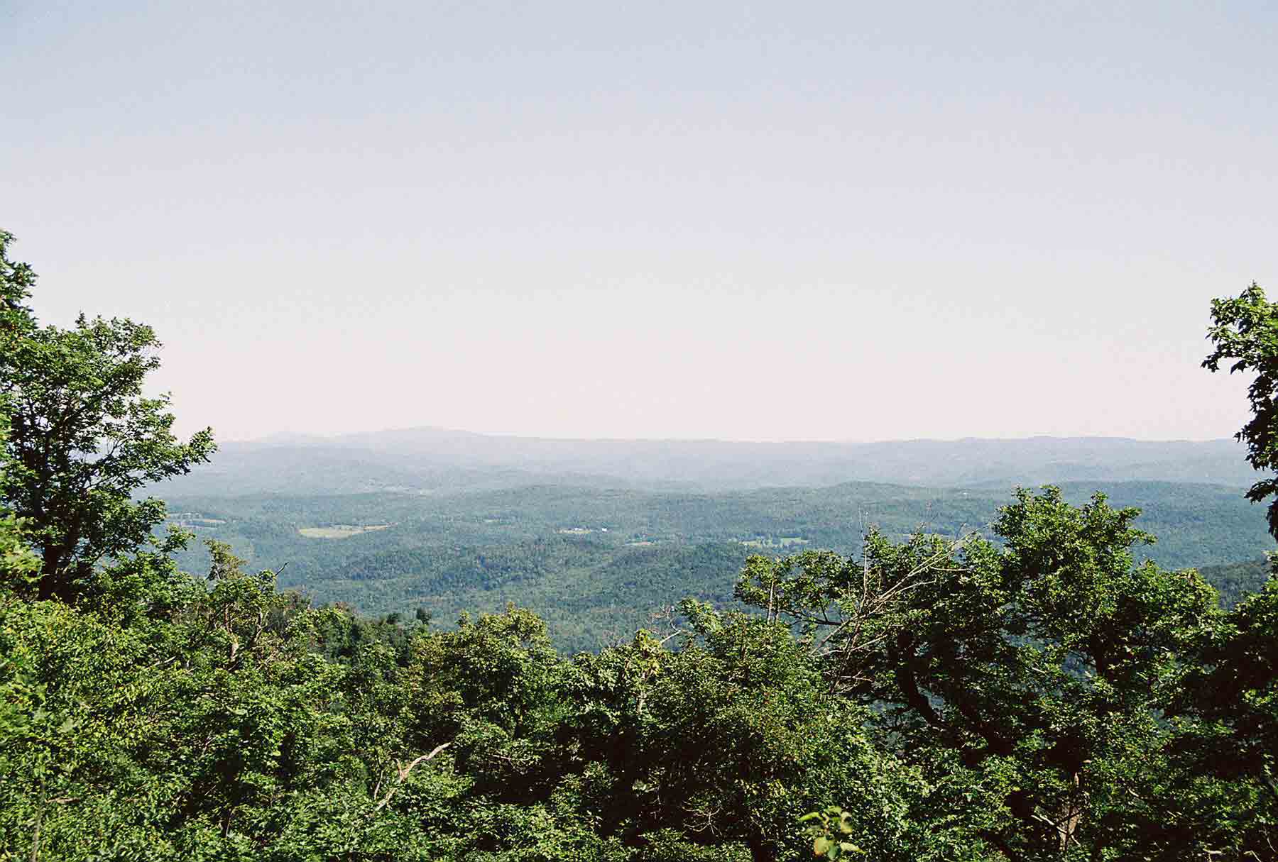 mm 7.8 - View NE from Lakota Lake Lookout. In the distance a range of mountains can be seen. The two peaks on the left are Mt. Cube and Smart's Mt in New Hampshire. The AT climbs both of these.  Courtesy dlcul@conncoll.edu