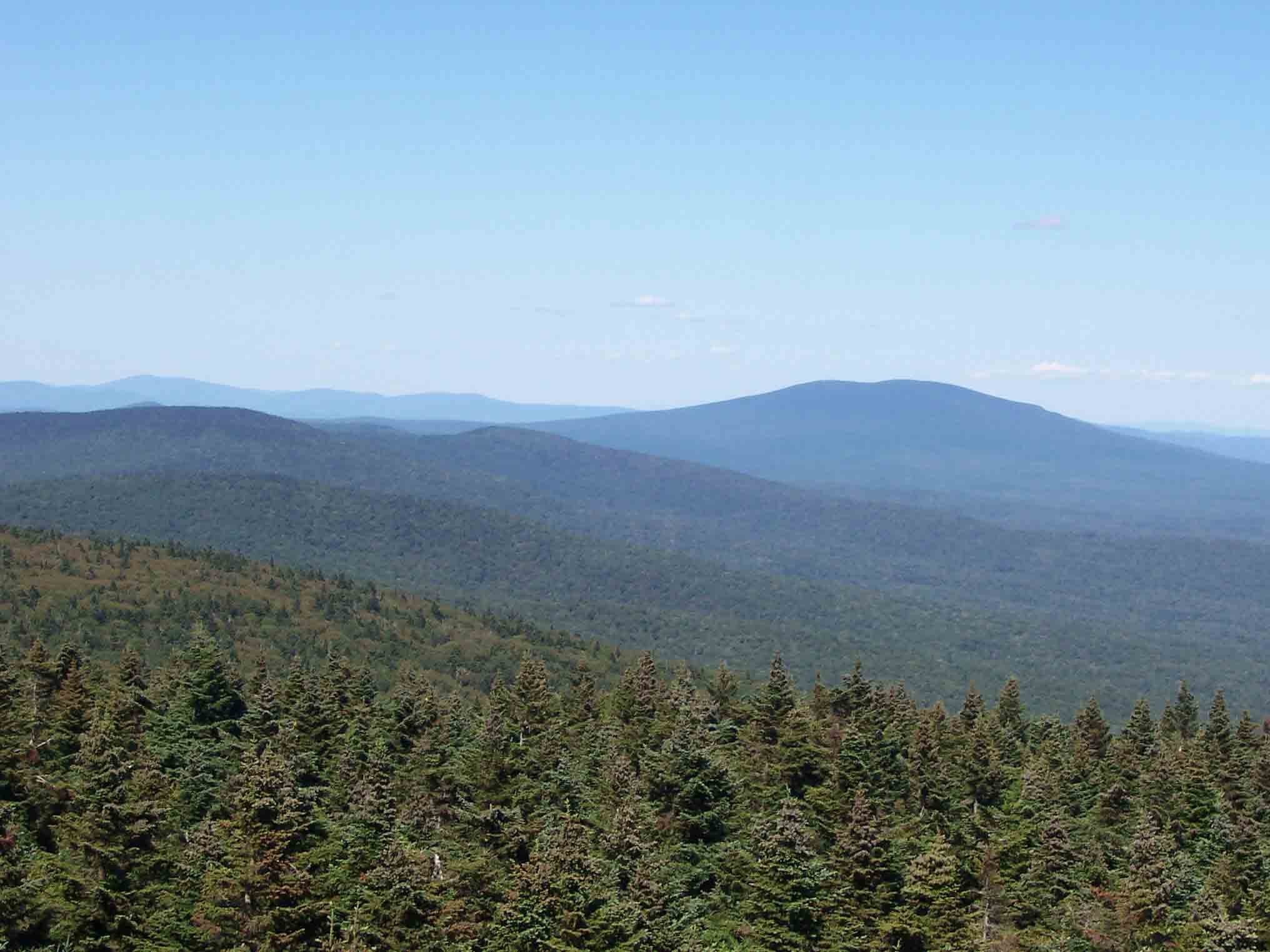 mm 12.2 - View north from firetower on Glastenbury Mt. The large moutain is Stratton. The northbound trail more or less follows the ridge on the left side of the picture then goes up and over the south peak of Stratton.    Courtesy dlcul@conncoll.edu