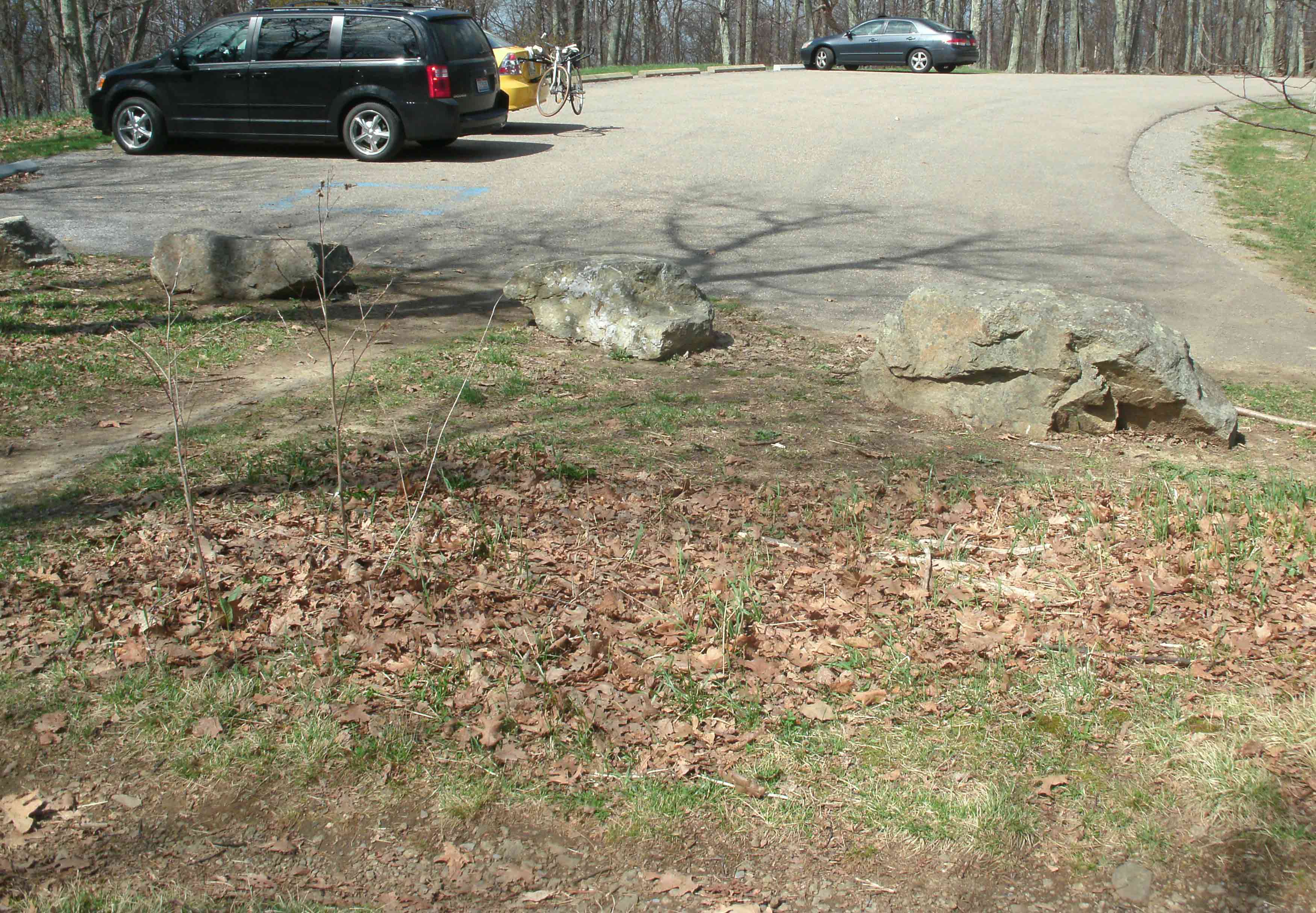 mm 3.4 The AT goes right by the Hogback Mountain South Parking Lot, just south of Milepost 21 on the Skyline Drive. The actual AT is the trail at the bottom of this photo, which is looking north from the south side of the lot.  Courtesy MalteseCross@Comcast.net